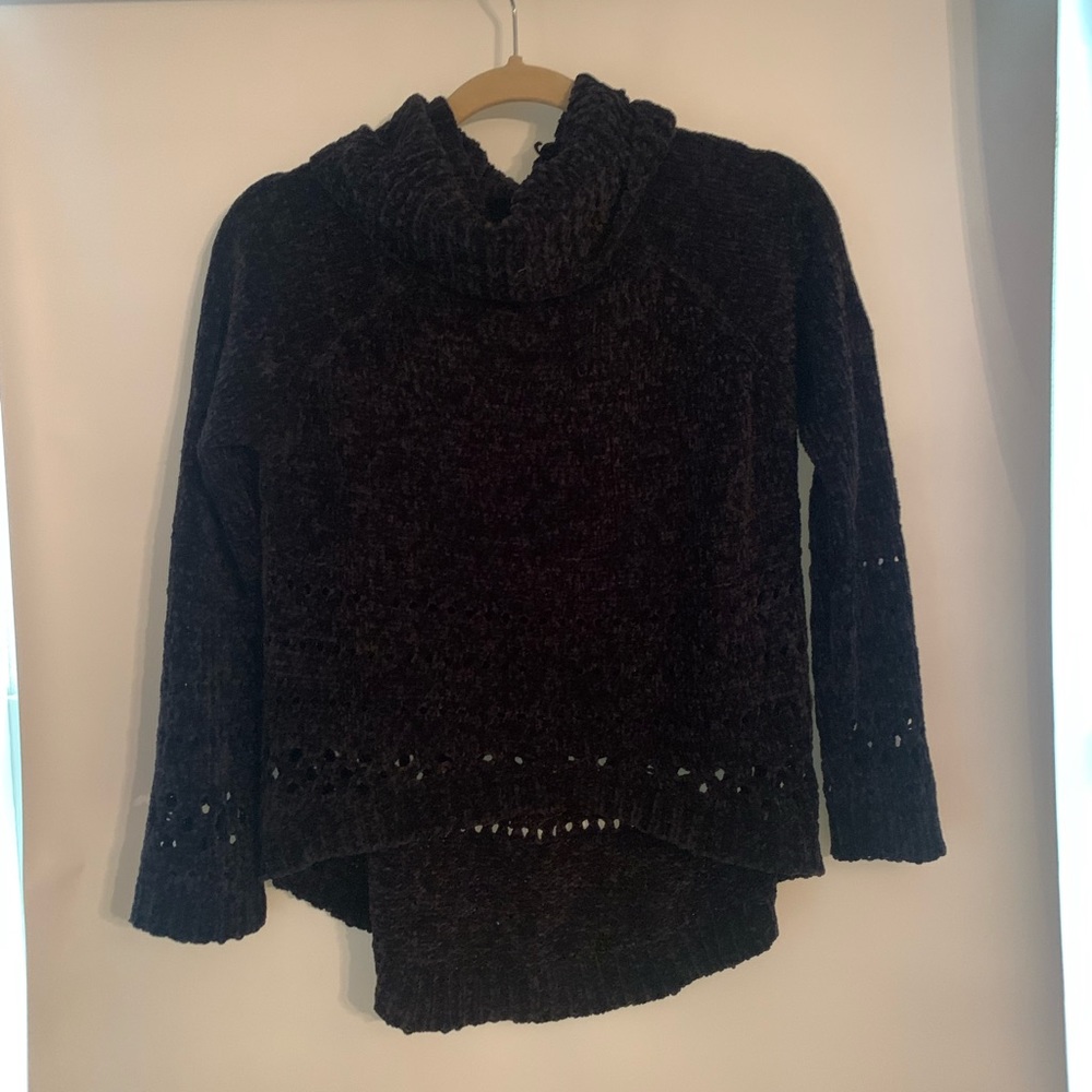 Black sweater with turtleneck, intricate design